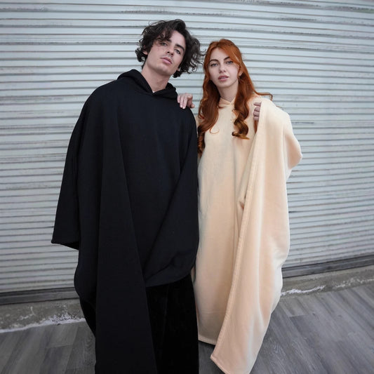 Coated with buttons, loose-fitting woolen cape with a hood
